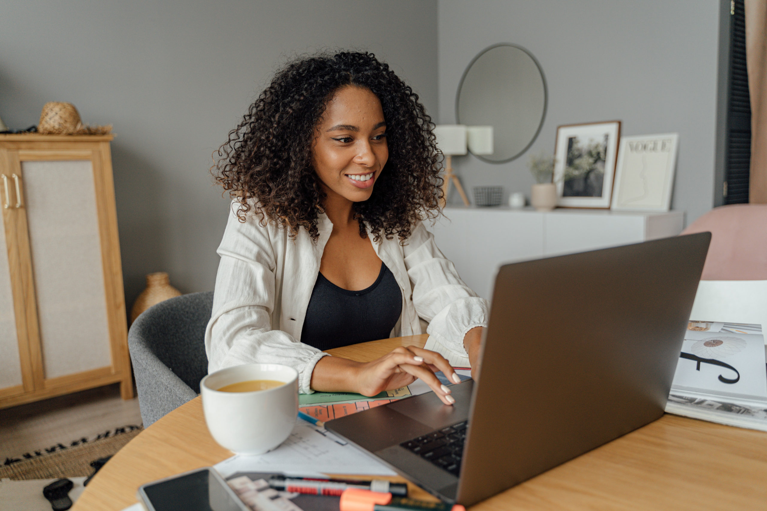 African American Woman Sitting at Computer