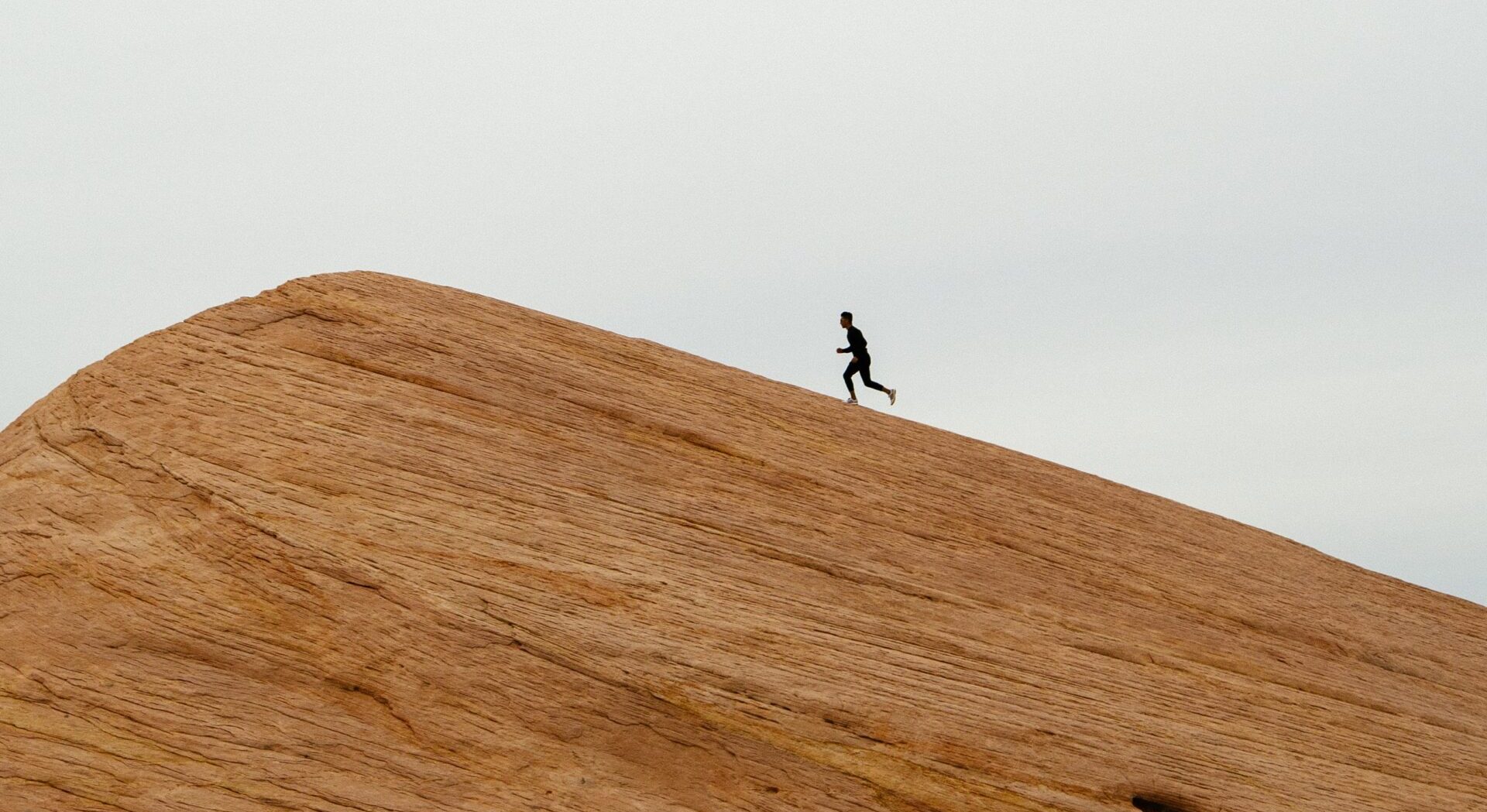 man running up hill